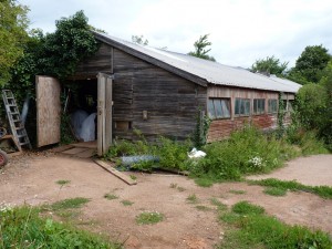 Farm shed alarm to protect ride-on mower and quad bike